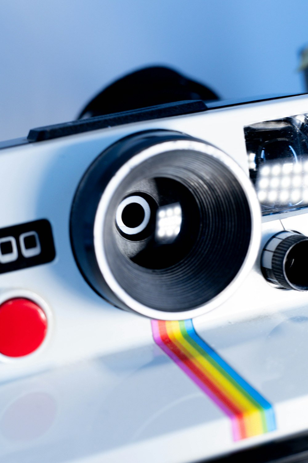 a close up of a camera with a rainbow on it