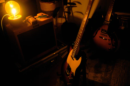 A cozy music lesson in progress with guitar and piano in a warm-lit room.
