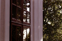 Close-up of sleek PVC window frames with a scenic outdoor view.