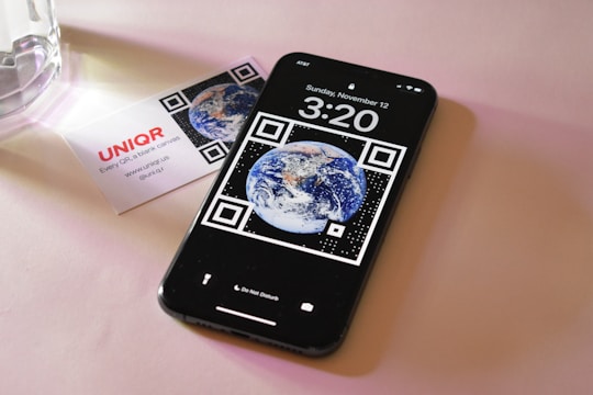 A smartphone displaying an interactive digital business card with animated icons.
