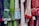 A colorful display of dresses with various polka dot and floral patterns. The fabrics feature a mix of vibrant colors including green, blue, red, and white. Ruffled sleeves and lace accents add texture, while price tags are visible hanging from some of the garments.