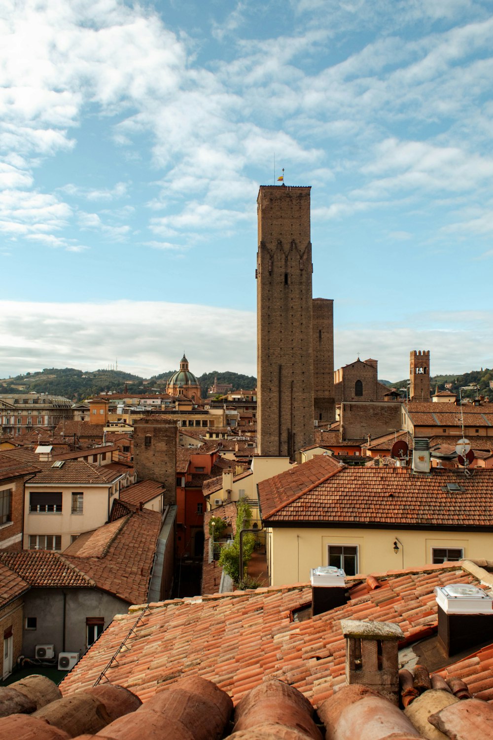 a view of a city with a clock tower in the background