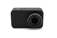 A compact, black rectangular camera with a prominent lens. The lens has markings for F2.8, 3.2mm, FOV 145, and UV filter. A small red button can be seen on the top, indicating a recording function.