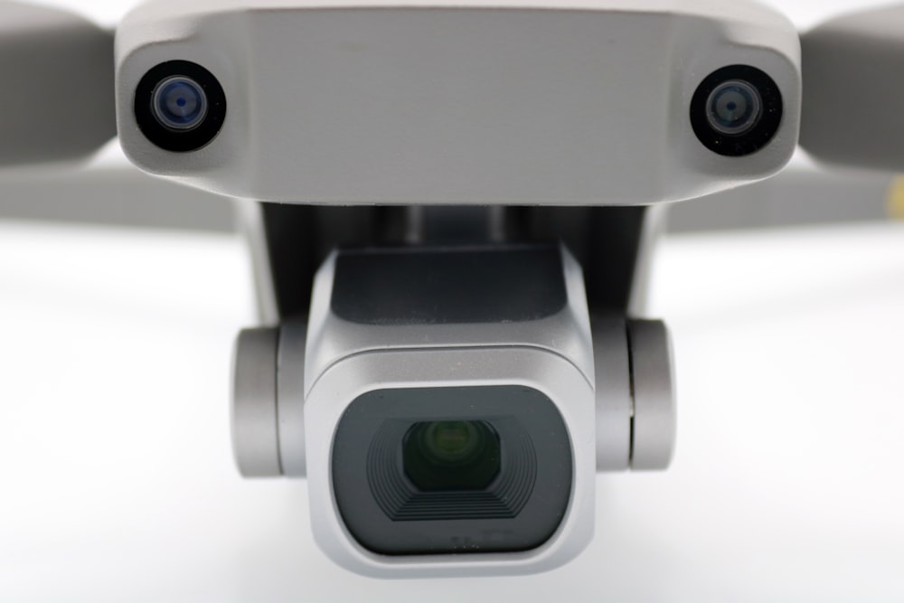 a close up of a video camera on a white surface