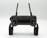 a black device with two handles and two buttons