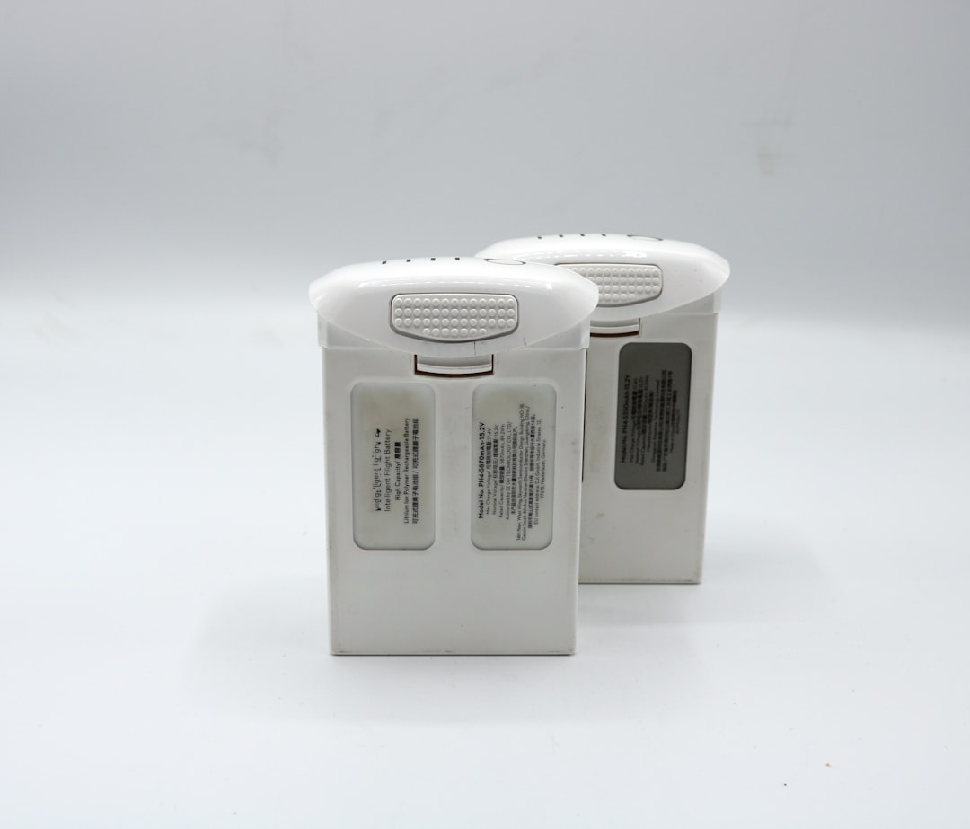 a couple of white batteries sitting next to each other,