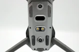 Close-up of a sleek drone casing labeled with part number DC-101, neatly stacked in the warehouse.