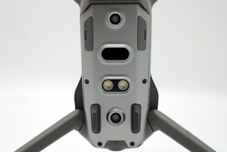 Close-up of modular payload mounted on UAV with HUD interface glowing softly.