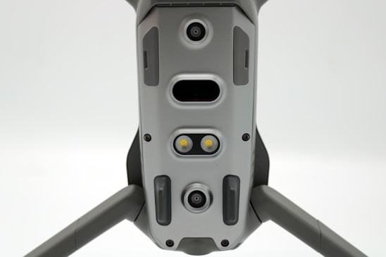 A sleek, dark-mode tactical UAV interface displaying live swarm data and mission overlays against a night sky.