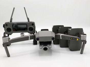 FPV drone components displayed with a remote controller