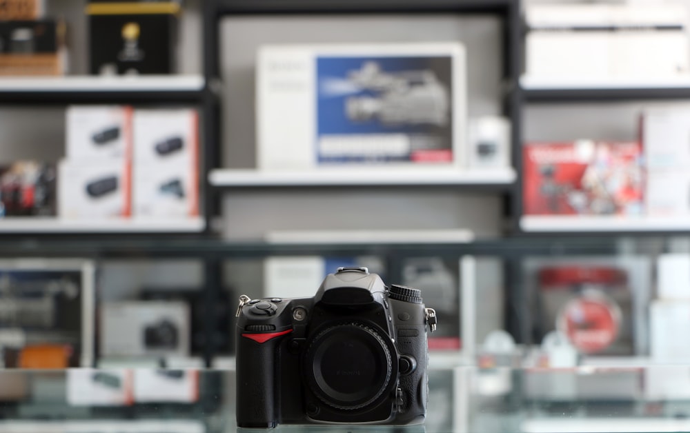 a camera sitting on top of a glass table