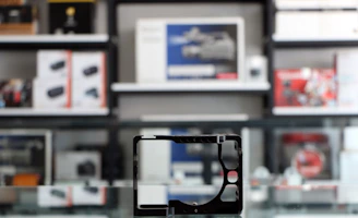 Brightly lit shelves filled with various electronic gadgets and accessories