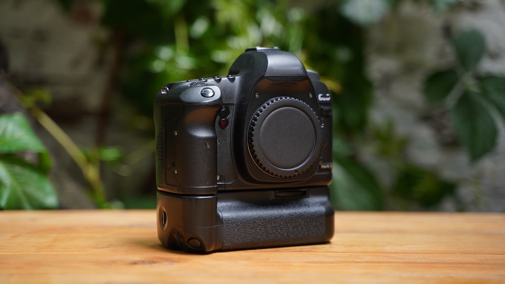 a camera sitting on top of a wooden table