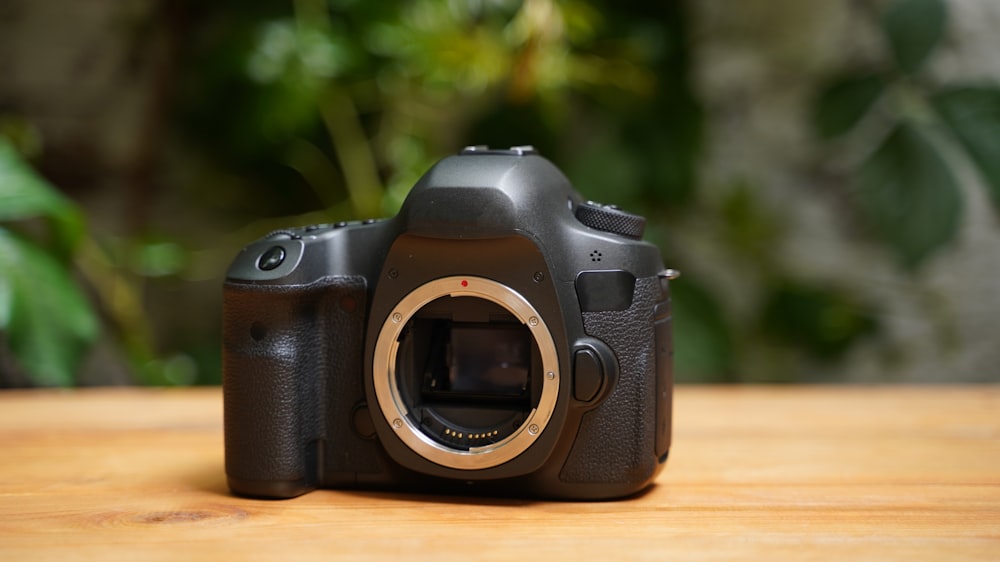 a camera sitting on top of a wooden table