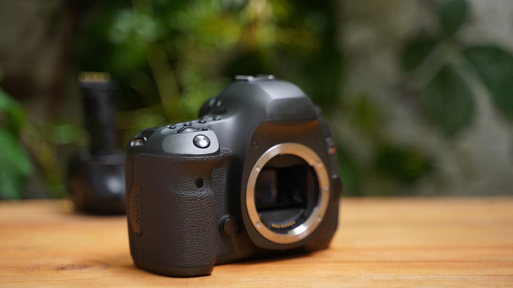 a camera sitting on top of a wooden table