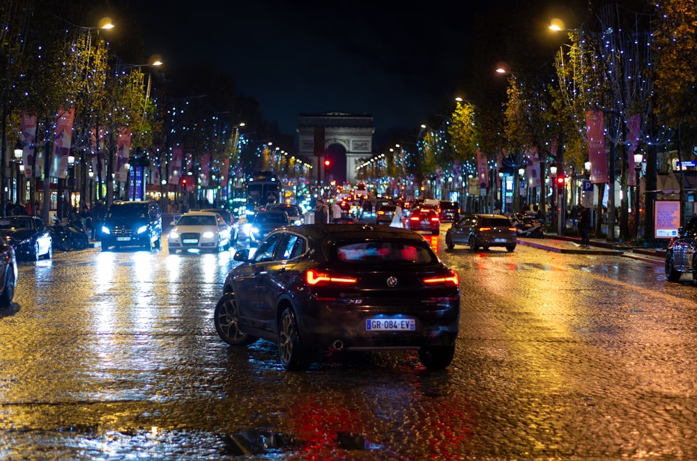 a city street filled with lots of traffic at night