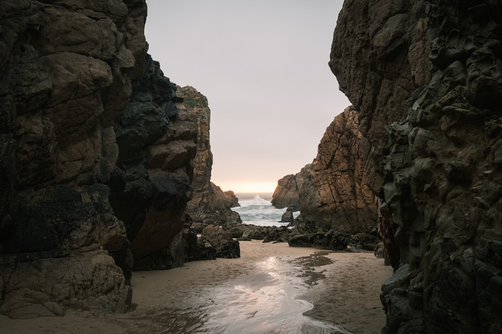 a view of the ocean from a rocky beach