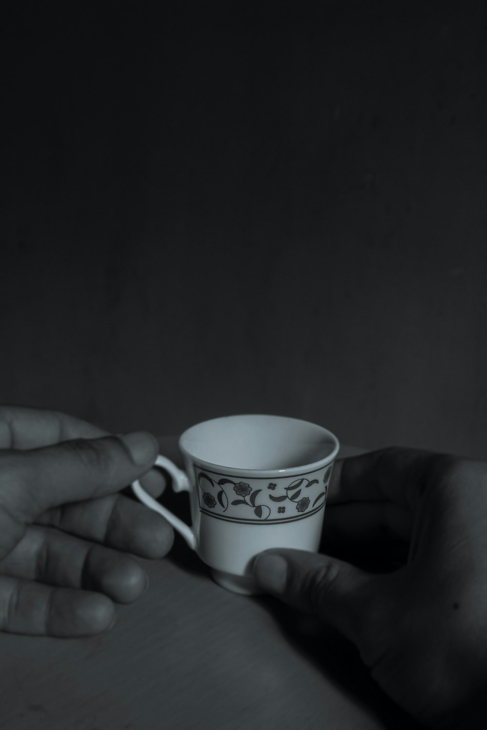 a person holding a coffee cup in their hand