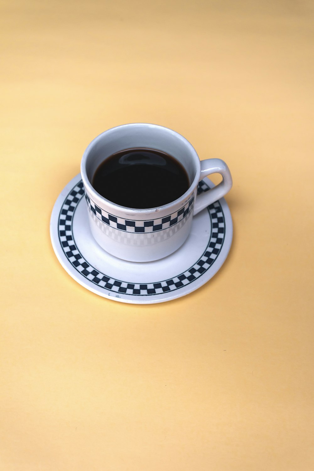 a cup of coffee sitting on top of a saucer