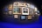 A vibrant gallery wall filled with various framed photographs showcasing landscapes and portraits.