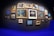 A vibrant gallery wall filled with various framed photographs showcasing landscapes and portraits.