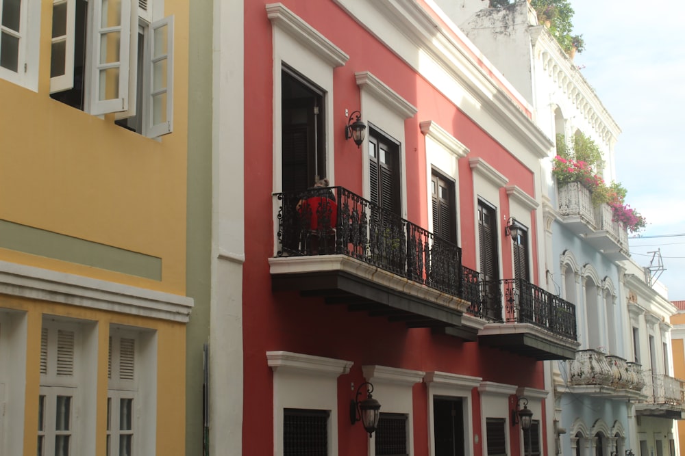 a row of colorful buildings with balconies and balconies