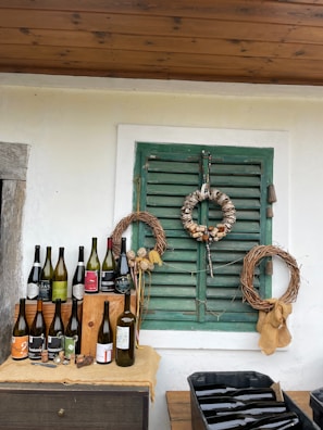 A selection of local wines displayed in a rustic setting.