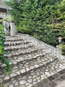 A charming set of custom stone steps leading up to a welcoming front porch.