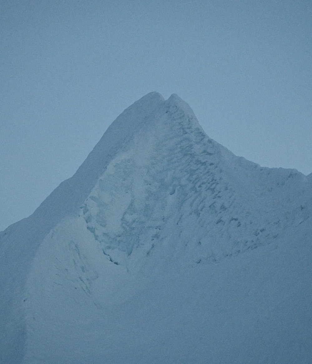 a person skiing down a snow covered mountain