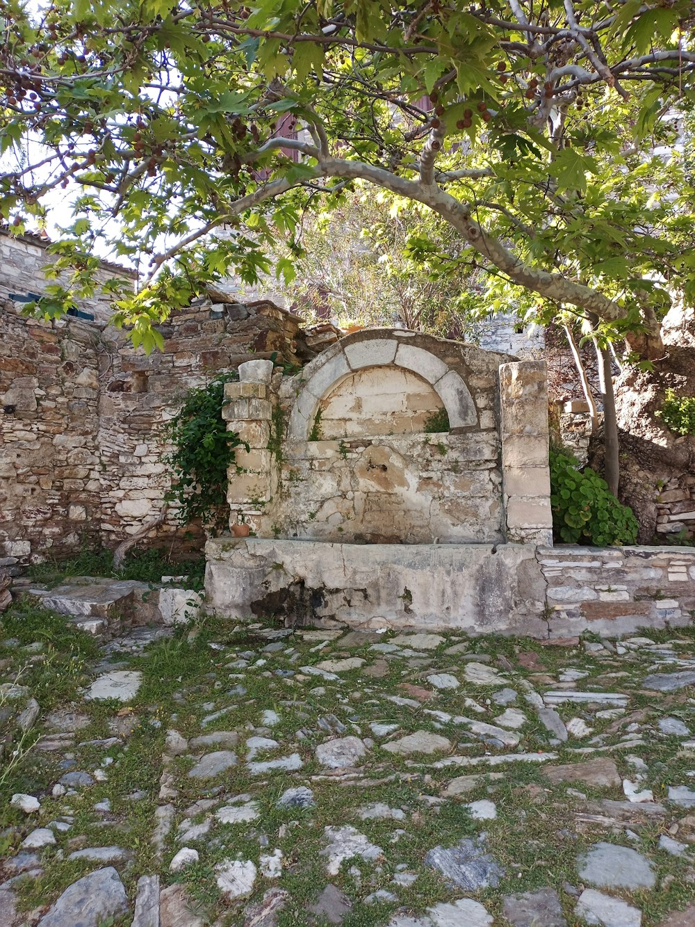 a stone building with a door in the middle of it