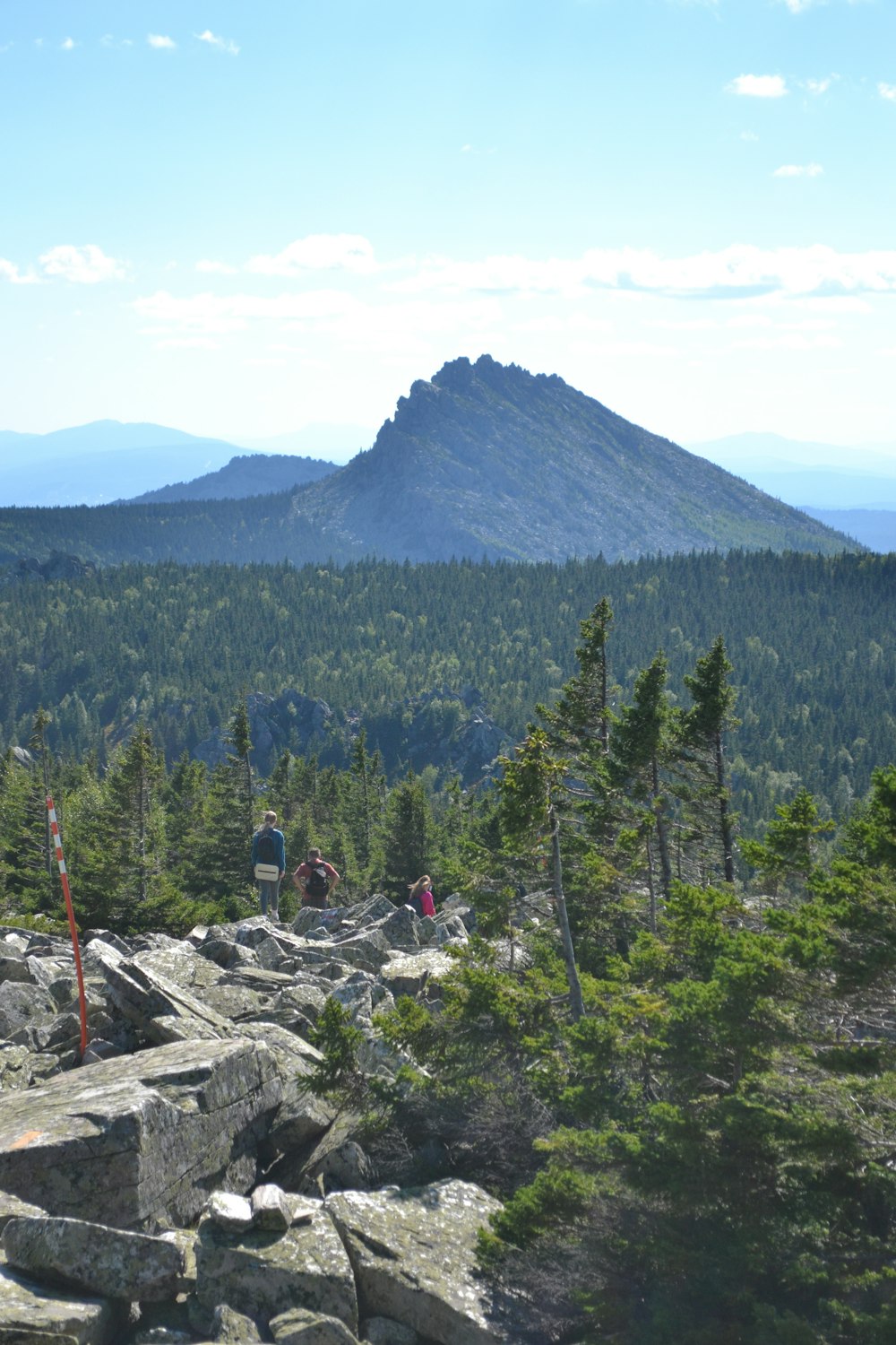 a group of people hiking up a mountain