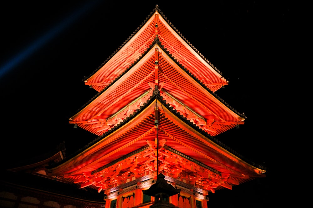 a tall tower with a red light on top of it