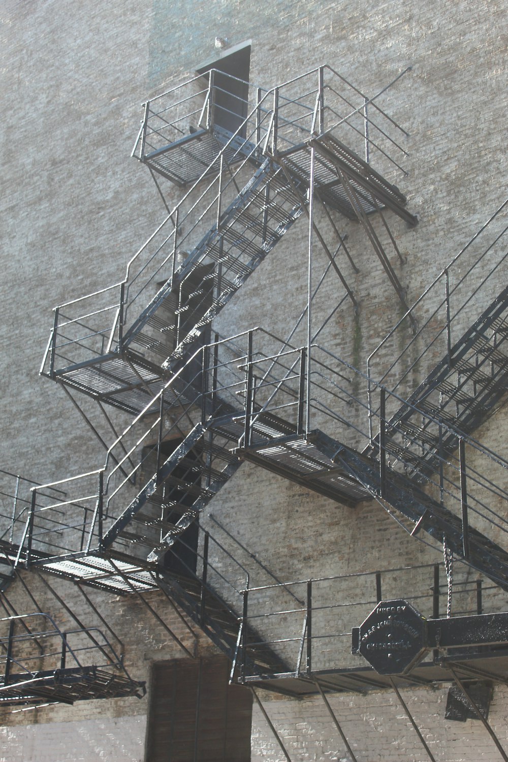 a very tall building with a bunch of metal stairs