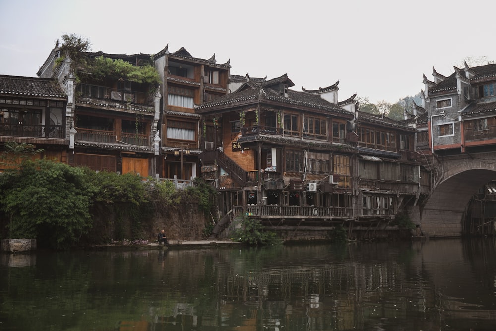 a bridge over a body of water next to buildings