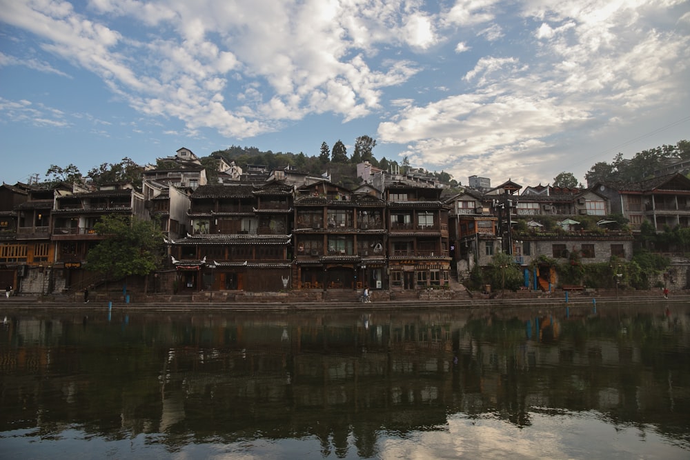 a large building sitting on the side of a river