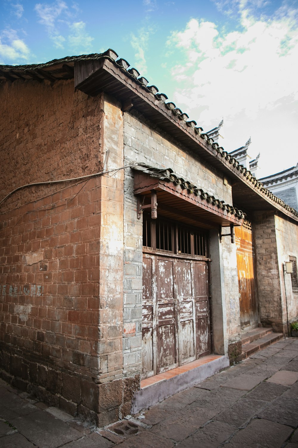 an old building with a wooden door and window