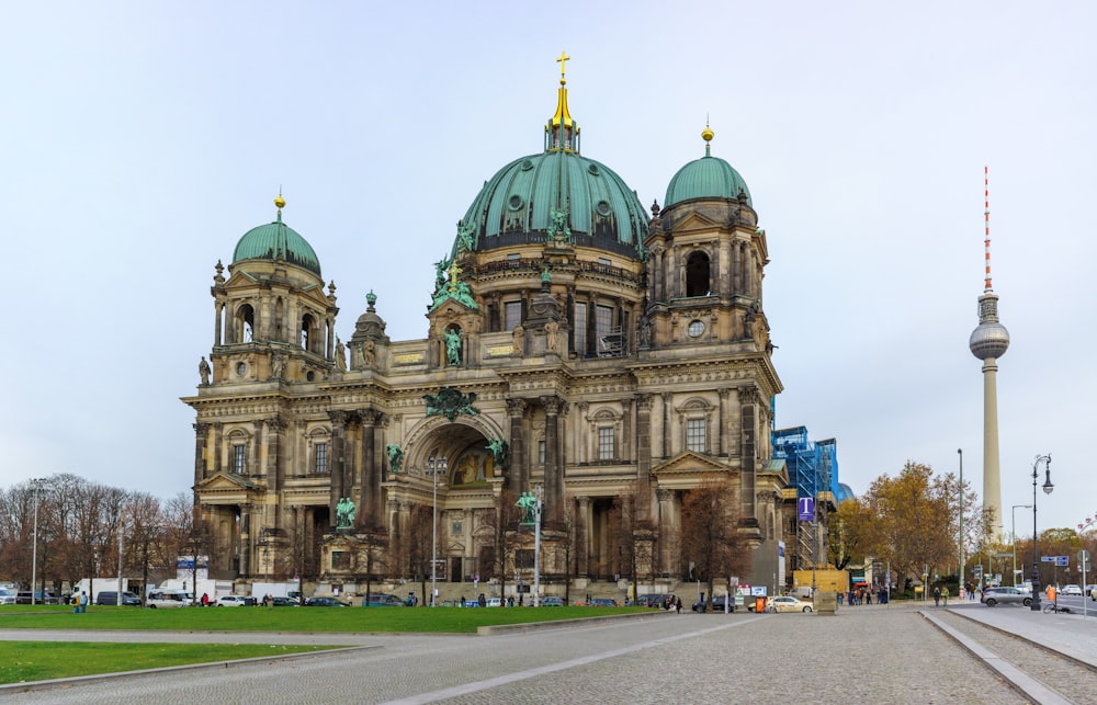 a large building with a green dome on top of it