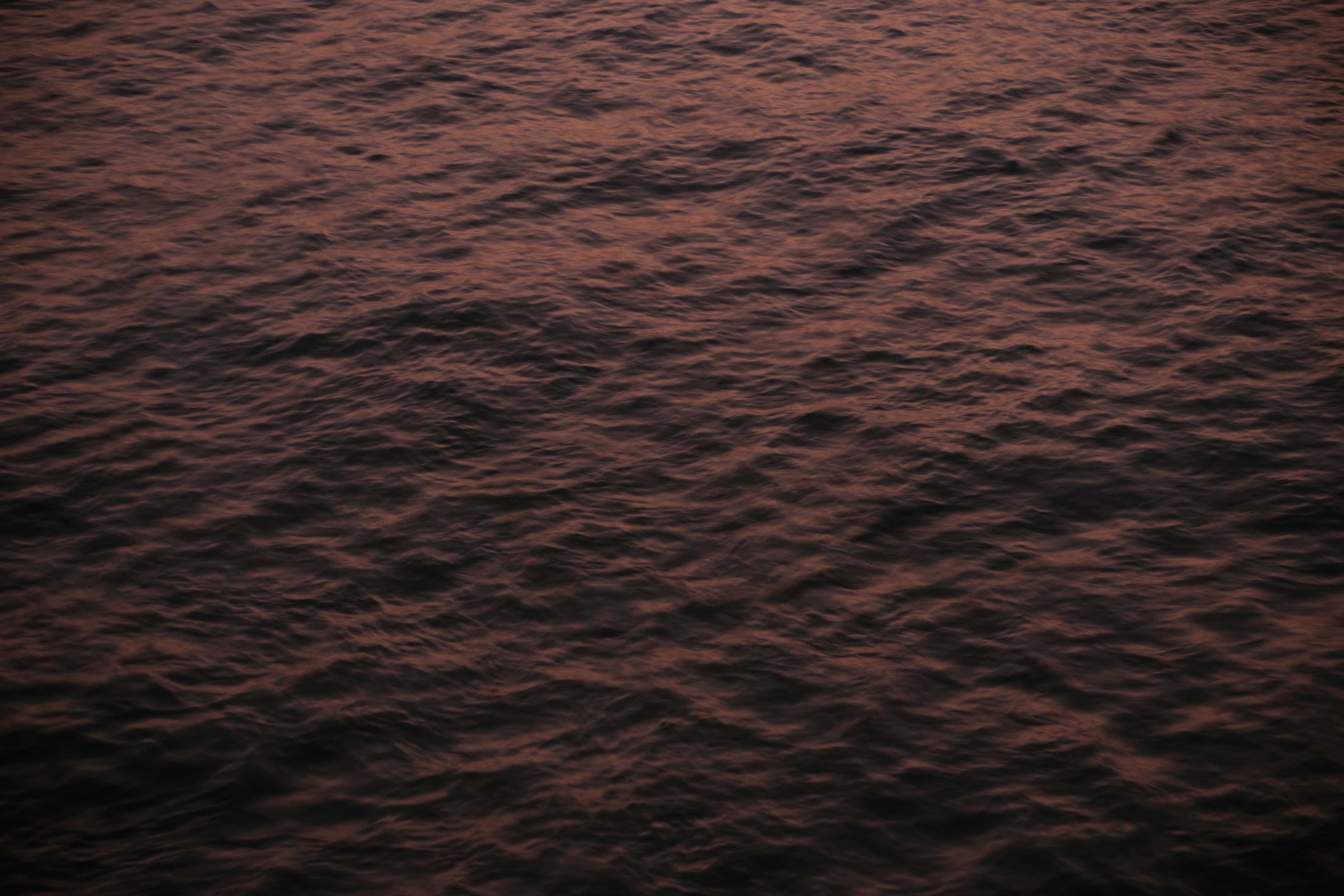 a red sunset over a body of water