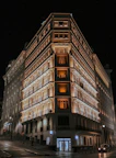a very tall building lit up at night
