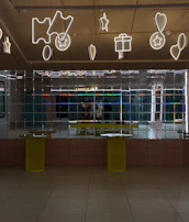 A modern office wall adorned with stylish acrylic mirror art pieces.