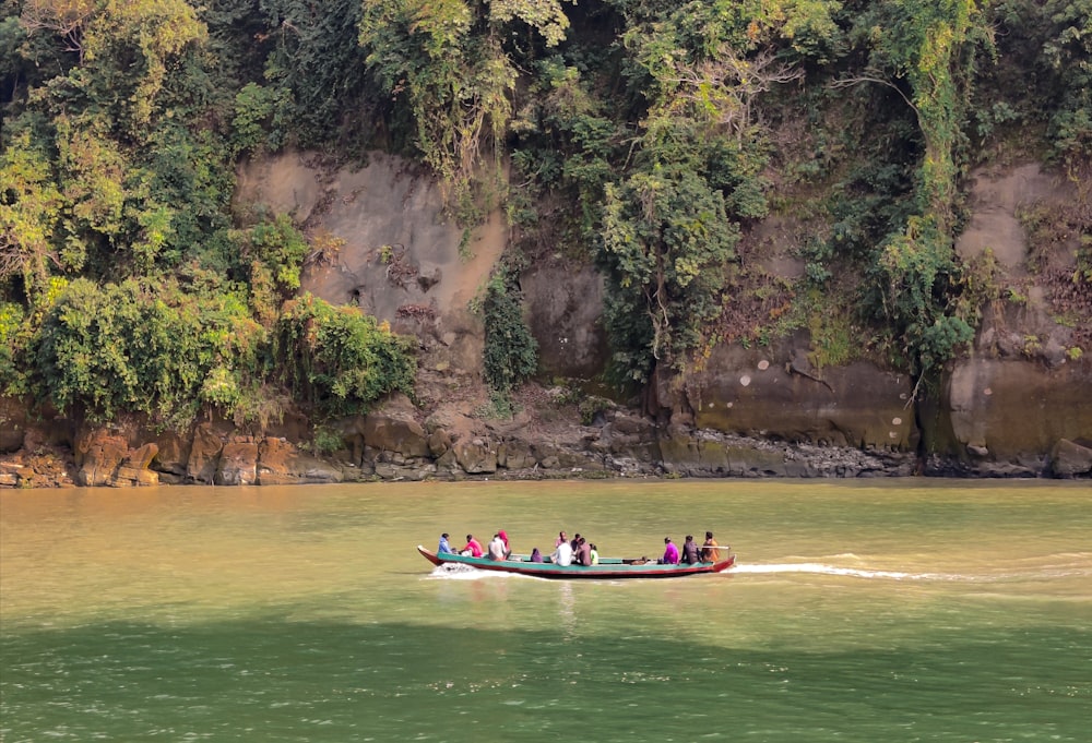 a group of people riding on the back of a boat