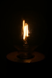 A soft glowing light bulb symbolizing a bright idea in the dark.