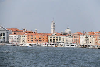 Stresa's elegant waterfront with colorful boats moored gently along the shore.