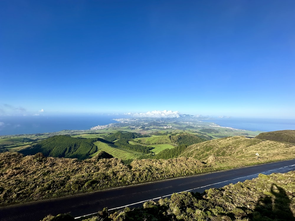 a scenic view of the ocean from a hill