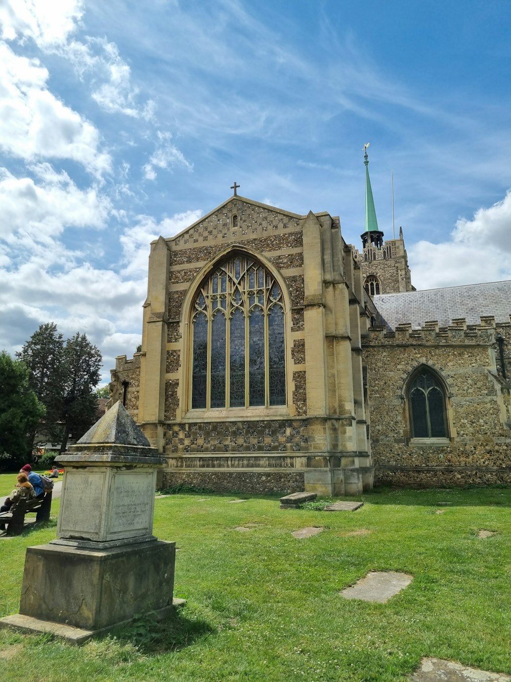 an old church with a statue in front of it