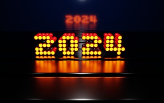 a lit up sign with the word boss on it