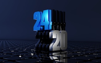A futuristic scene featuring large, bold numbers '24' and '20' standing on a reflective grid surface. The number '24' is in a vibrant blue, while '20' is in a metallic silver. The grid reflects the numbers, adding depth to the image, which is set against a dark, minimalist background.