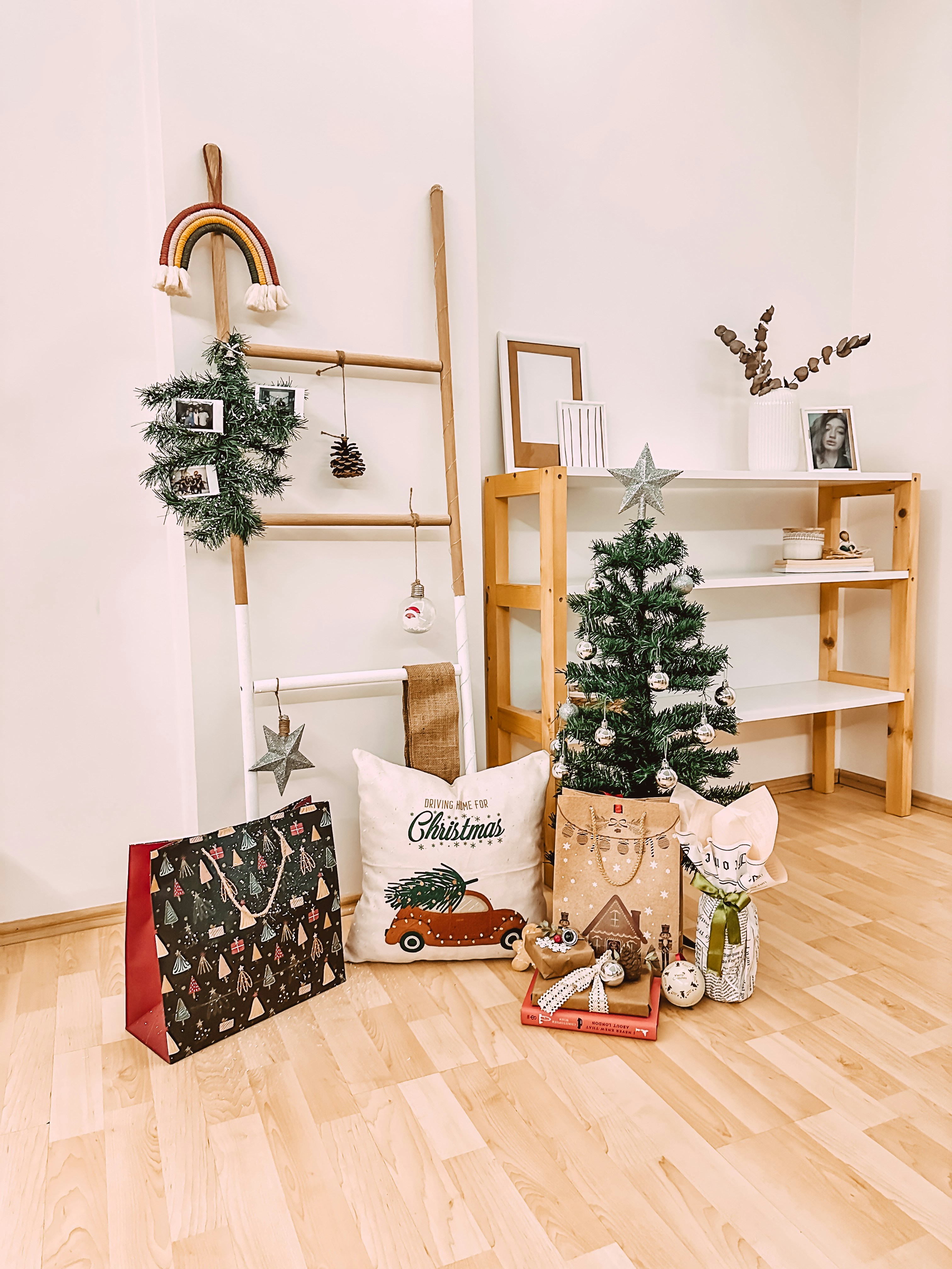 a living room filled with furniture and a christmas tree