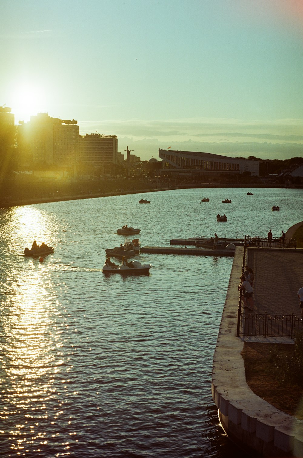 a group of people in small boats on a body of water