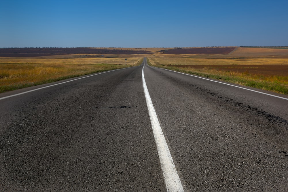 an empty road in the middle of nowhere